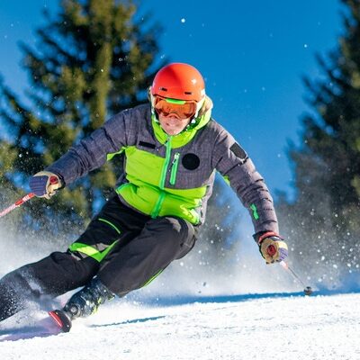 Skier carving a turn on a ski slope in Montenegro
