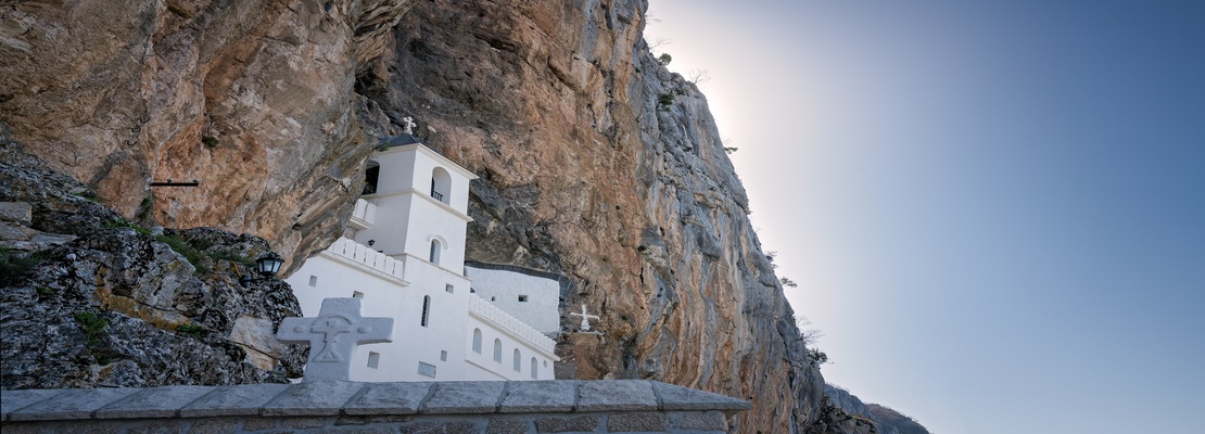 View of the Ostrog Ortodox Monastery built into the cliff in Montenegro.