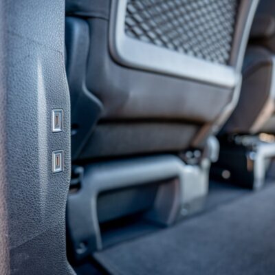 Interior of a Toyota Proace Verso passenger van with rear USB charging ports, operated by LAZEX TRANSFER